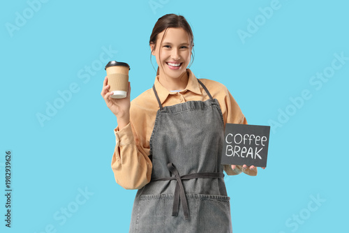 Happy young female barista ...