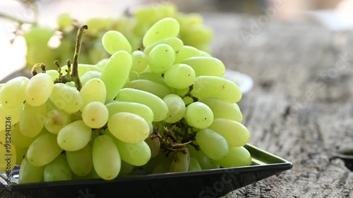 Fresh green grape or shine muscat grape fruit. Healthy eating. Fresh ripe grapes on wooden table, close up