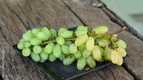 Fresh green grape or shine muscat grape fruit. Healthy eating. Fresh ripe grapes on wooden table, close up