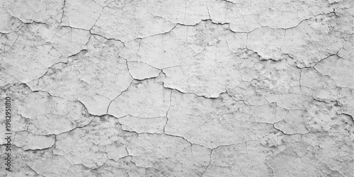 A weathered gray concrete wall surface with a cracked grunge texture and aged plaster material creates a rough vintage pattern on the dirty weathered stone background