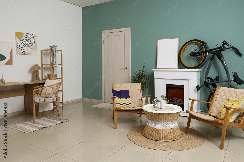 Obraz premium Interior of living room with bicycle, fireplace and armchairs