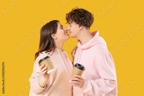 Young couple with coffee cu...