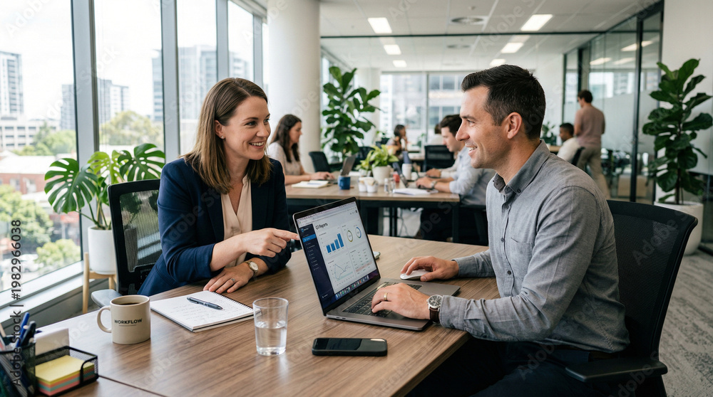 Obraz premium Two Confident Businesspeople Discussing the Project in the Modern Office Environment