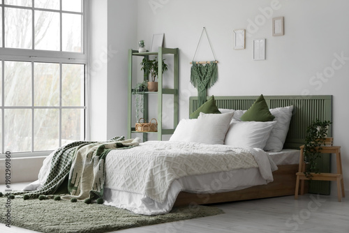 Modern bed with green plaid...