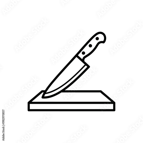 A knife on a cutting board.