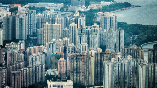 Sea gate. Hong Kong as a major port and residential areas with high-rise apartment buildings. View of the city from Victoria Harbor.