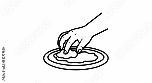 A hand gently places food onto a circular plate with concentric rings