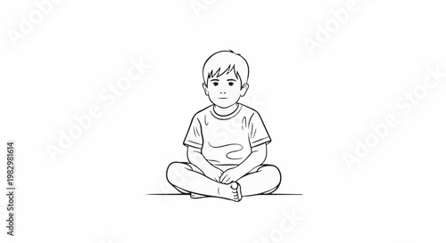 A child in a t-shirt sits cross-legged, facing forward