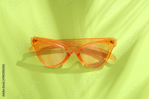 Stylish pink sunglasses on ...