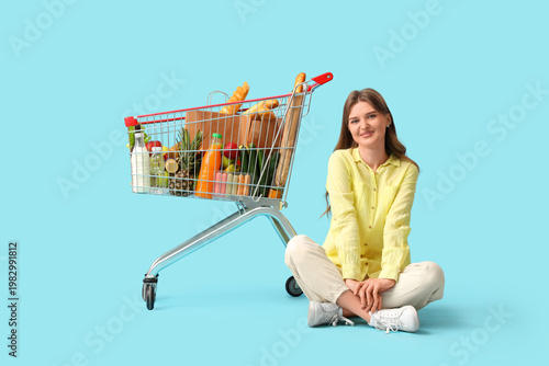 Young woman with full shopp...