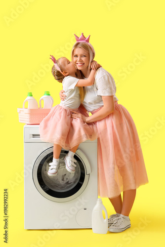 Little daughter kissing her...