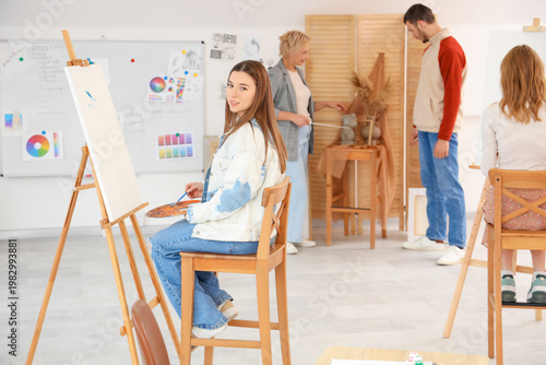 Female student drawing on c...