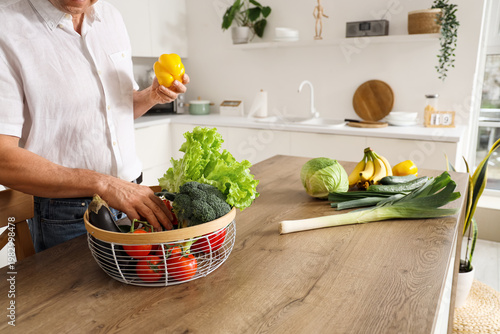 Mature man with basket of f...