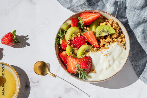 Healthy yogurt bowl with granola and fresh berries for clean eating diet