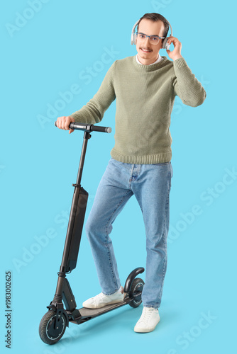 Young man in headphones wit...