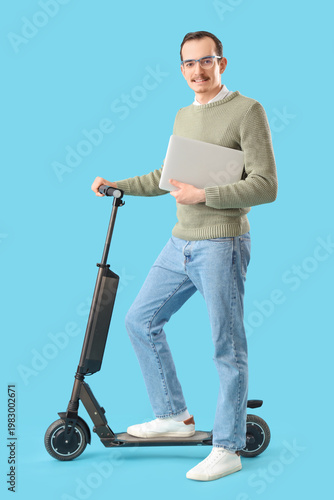 Young man with laptop and k...