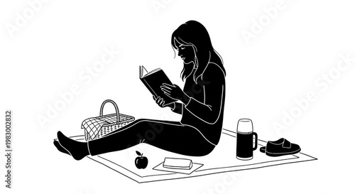 Woman reading a book during a picnic outdoors.