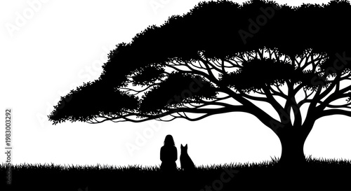 Silhouette of a woman and her dog sitting under a large tree in a field