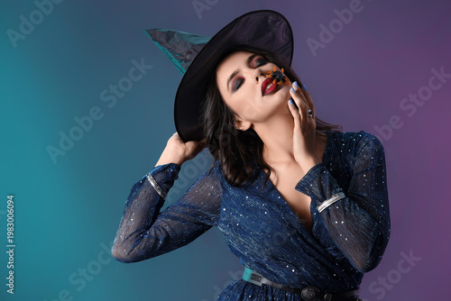 Young witch on dark color b...