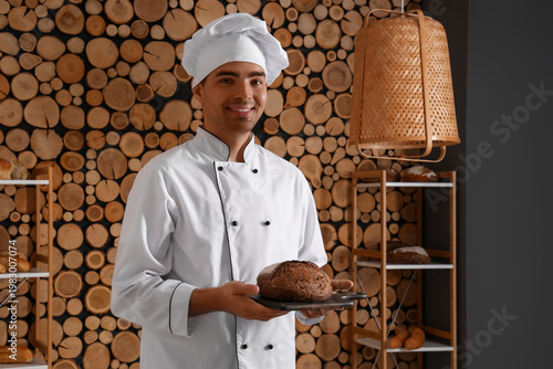 Young man with loaf of fres...