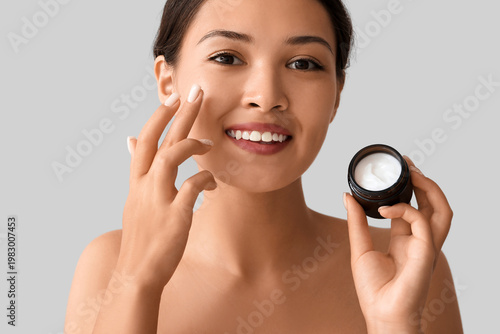 Beautiful Asian woman apply...