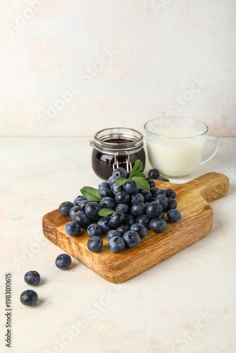 Wooden board with fresh blu...