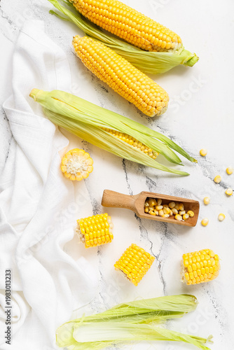 Fresh corn cobs and wooden ...