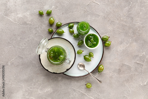 Jars and bowl with tasty go...