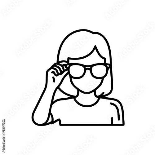 Adolescent girl trying on sunglasses with a playful expression  