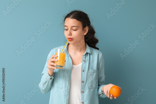 Teenage girl with orange dr...