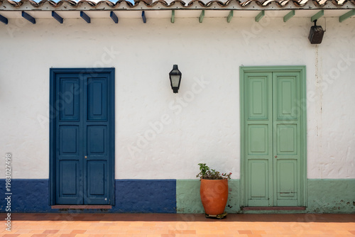 Colorful Colonial Facade With Blue And Green Doors