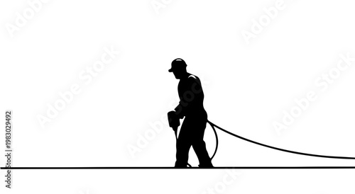 Construction worker operating equipment while walking on site  