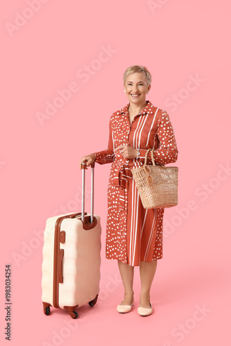 Mature woman with suitcase ...
