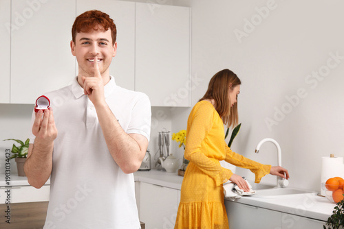 Young man with engagement r...