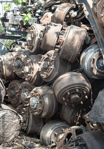Photos A massive, haphazard stack of heavy-duty vehicle components towers in a scrap yard