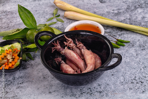 Boiled wild mini calamari snack