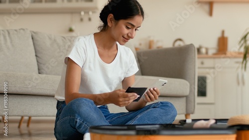 Slika na platnu Smiling Hindu Indian woman at home preparing for trip vacation travel female Ara