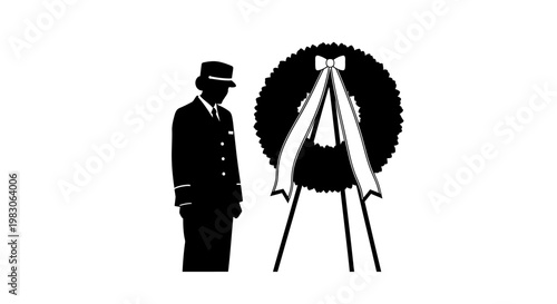 Soldier in Uniform Bows Head in Respect Before Memorial Wreath