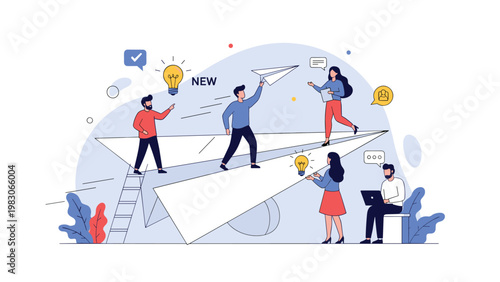 Innovative group of people working together to launch paper airplanes representing the start of new creative business projects and ventures.