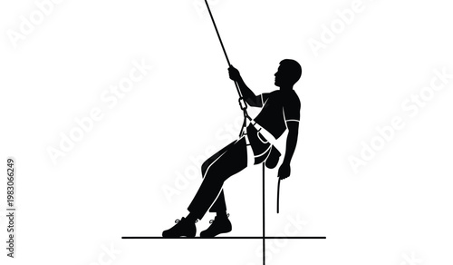 A stark black silhouette depicts a male rock climber suspended mid ascent highlighting the daring nature of the sport and its challenges silhouette