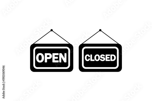Open and closed signs hanging on white background.