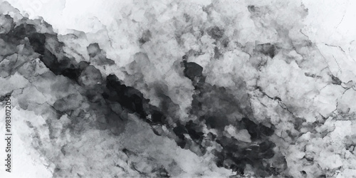 Isolated nature background featuring an abstract texture of black and white snow on mountain rocks under a dark storm sky with fog and white clouds