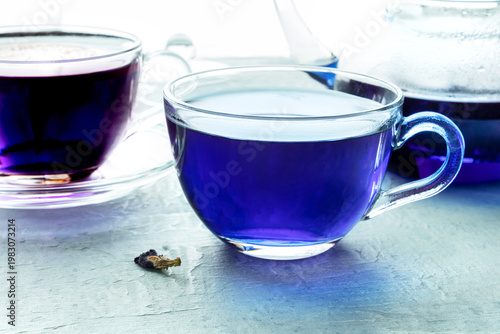 Blue tea, an infusion of butterfly pea flowers, with another cup
