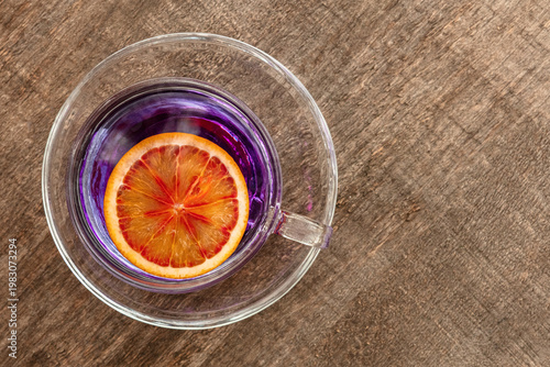 Blue tea, an infusion of butterfly pea flowers, with a citrus