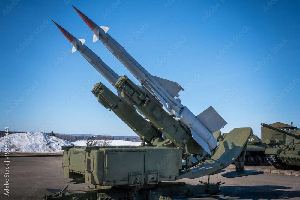 Fototapeta premium Soviet era air defense systems and military vehicles, radar units, helicopters and aircraft, missile defense concept, war and conflict theme