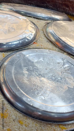 Uzbek Plov Cooking Covered with Metal Lids in Large Kazan