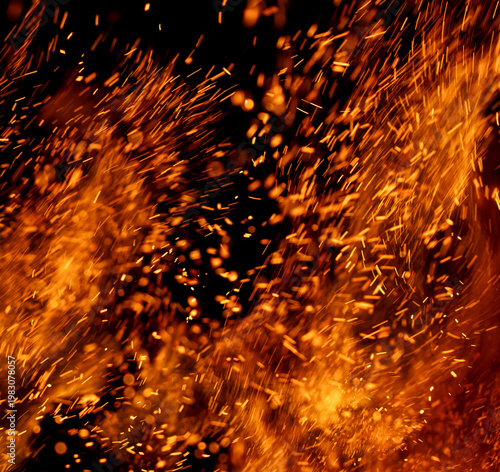 A fire is burning and the smoke is orange