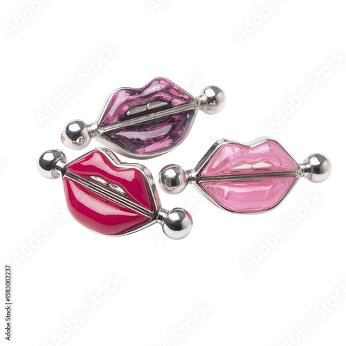 Three glossy lip-shaped piercings, varying pink/red hues, metal accents
