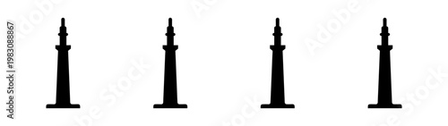 four vintage oil pumpjacks in row on flat industrial landscape at dusk