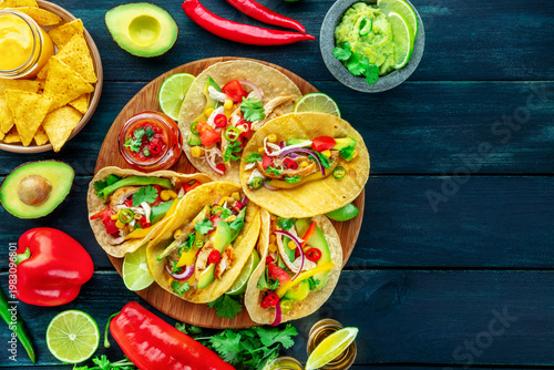 Wallpaper Mural Mexican food. Tacos, tequila, nachos, guacamole, overhead flat lay shot on a black background, with copy space and ingredients Torontodigital.ca